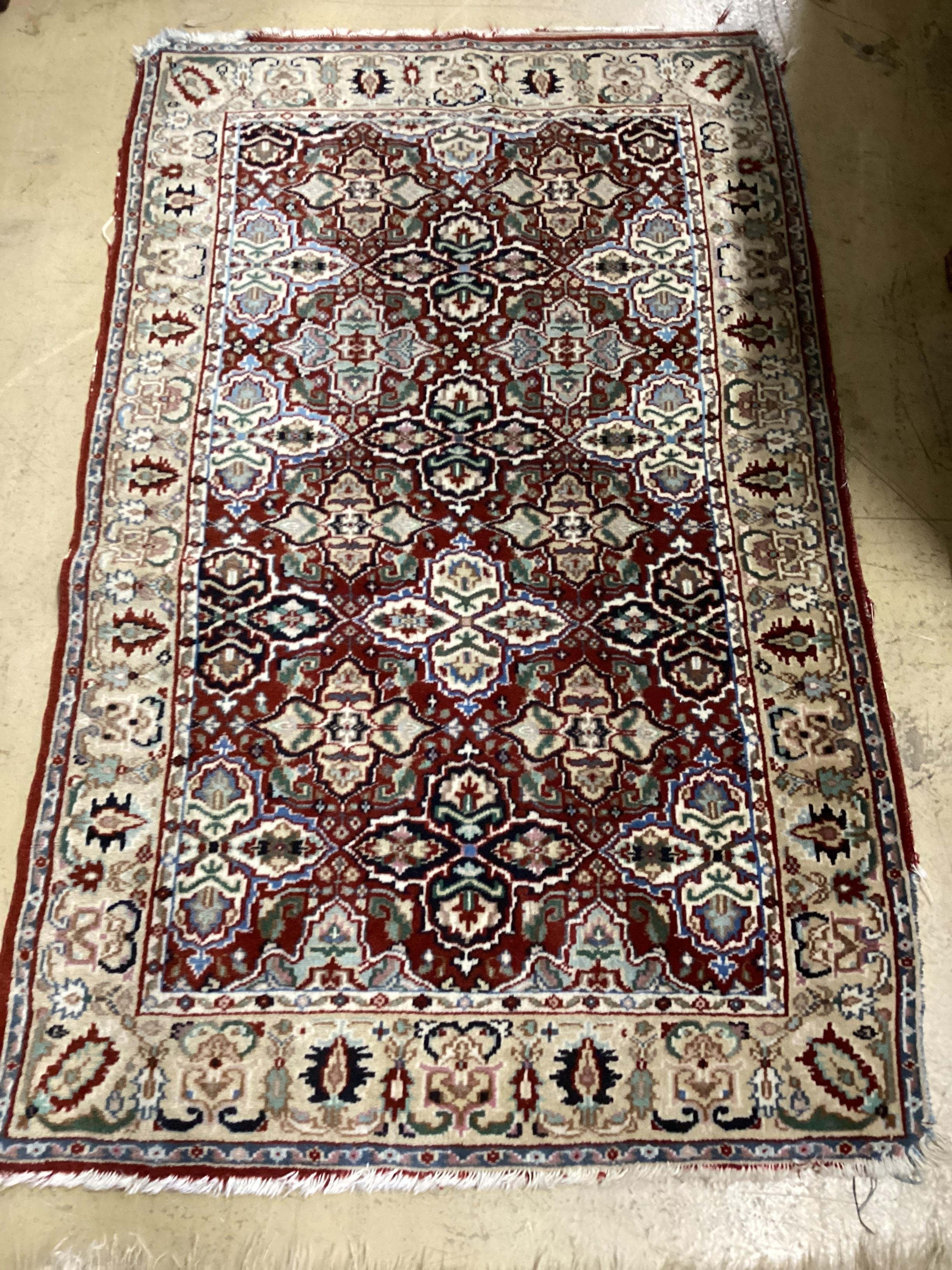 A North West Persian rug and a Bokhara rug, larger 114 x 84cm